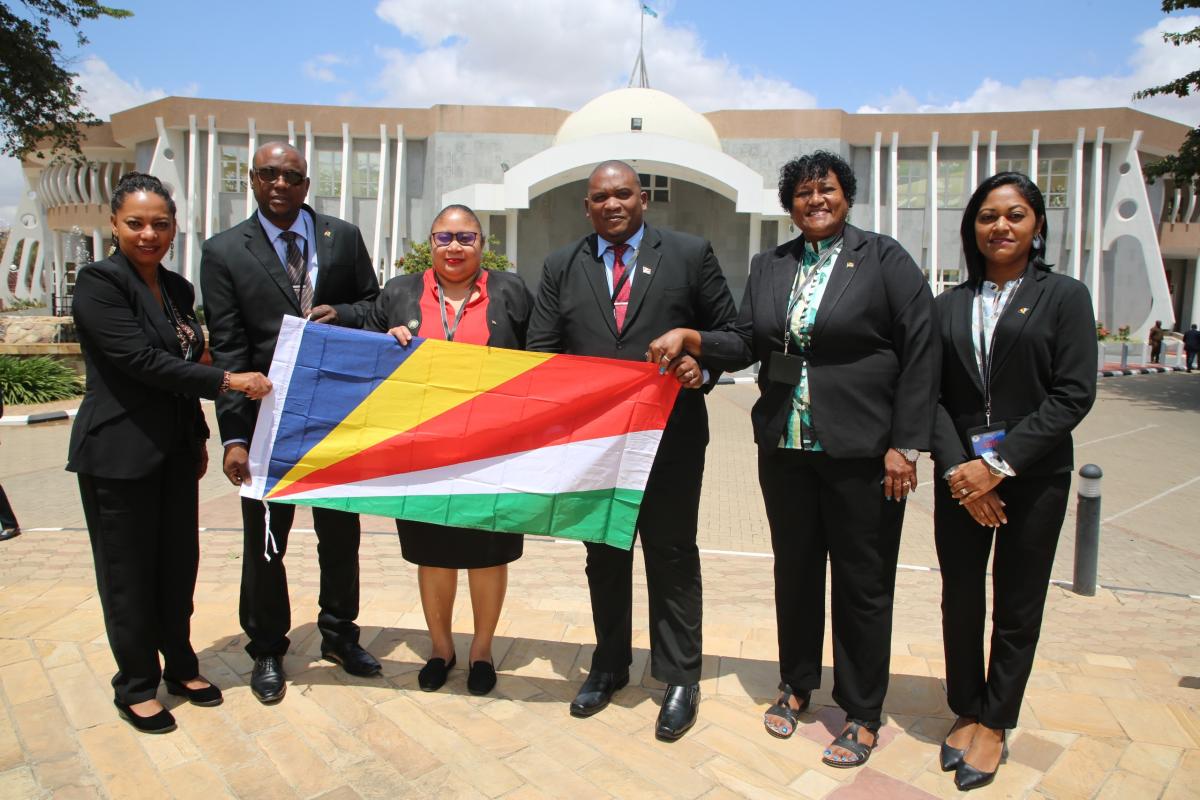 Seychelles Delegation holding a flag